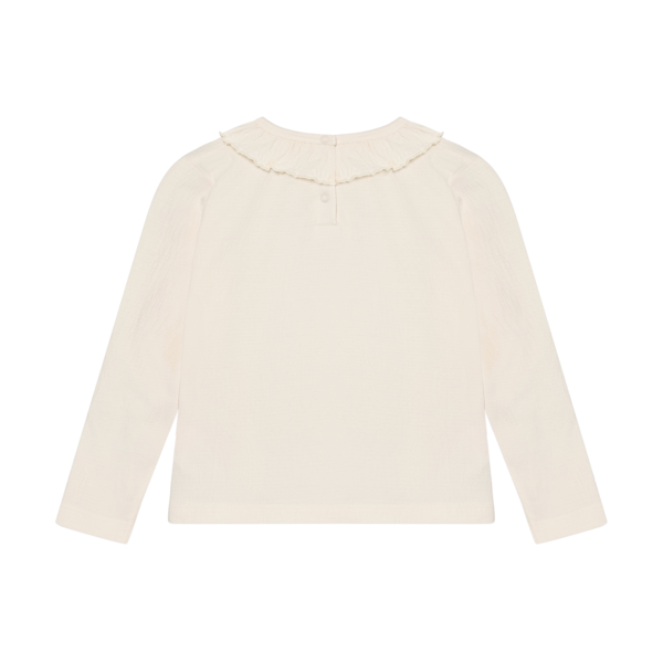 Valge pikkade varrukatega tüdrukute t-särk volangiga.