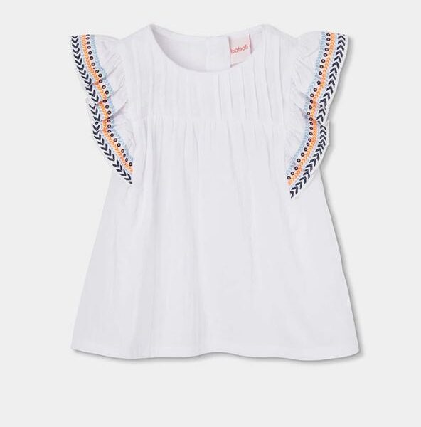 tüdrukute tikkitud valge särk volangiliste varrukatega